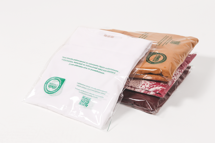 The first textile company to pack clothing in Woodly's carbon-neutral, wood-based plastic
