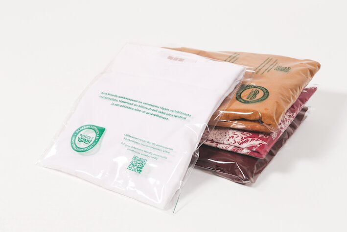 The first textile company to pack clothing in Woodly's carbon-neutral, wood-based plastic