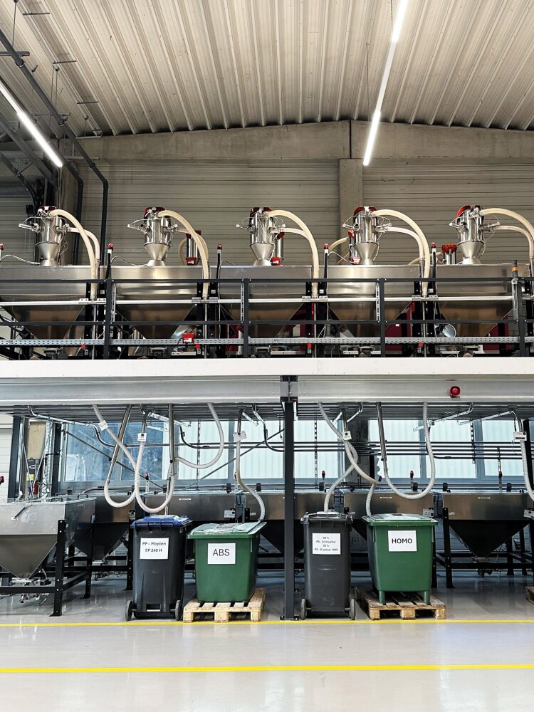 The dryer platform provides a view across the material storage area. The space directly under the platform is reserved for containers filled with the most frequently used materials.
