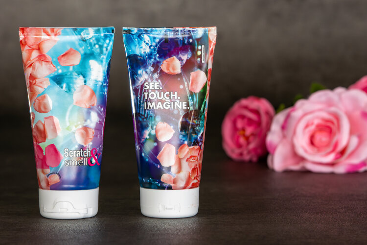 The plastic laminate tube from an Italian manufacturer features a lacquer with scented microcapsules that release a rose fragrance when rubbed. Image: Etma