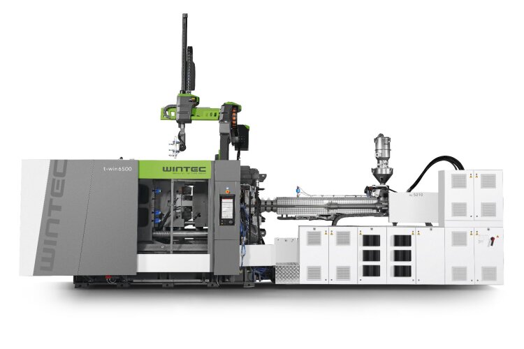 The Wintec t-win 6500 two-platen injection moulding machine with integrated viper 20 linear robot enables cost-efficient production of large-volume components at short cycle times.