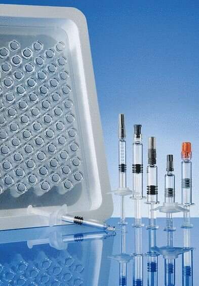 Glass and plastic syringe systems at the PDA