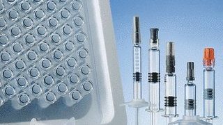 Glass and plastic syringe